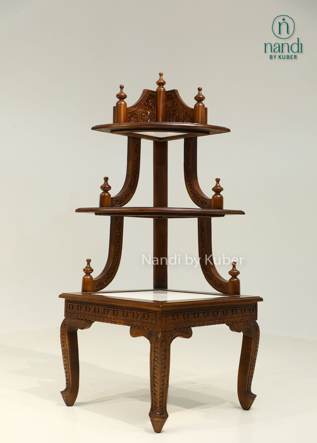 Handcrafted three-tier wooden corner display stand with intricate carvings, perfect for showcasing decorative accents, idols, plants, and collectibles.