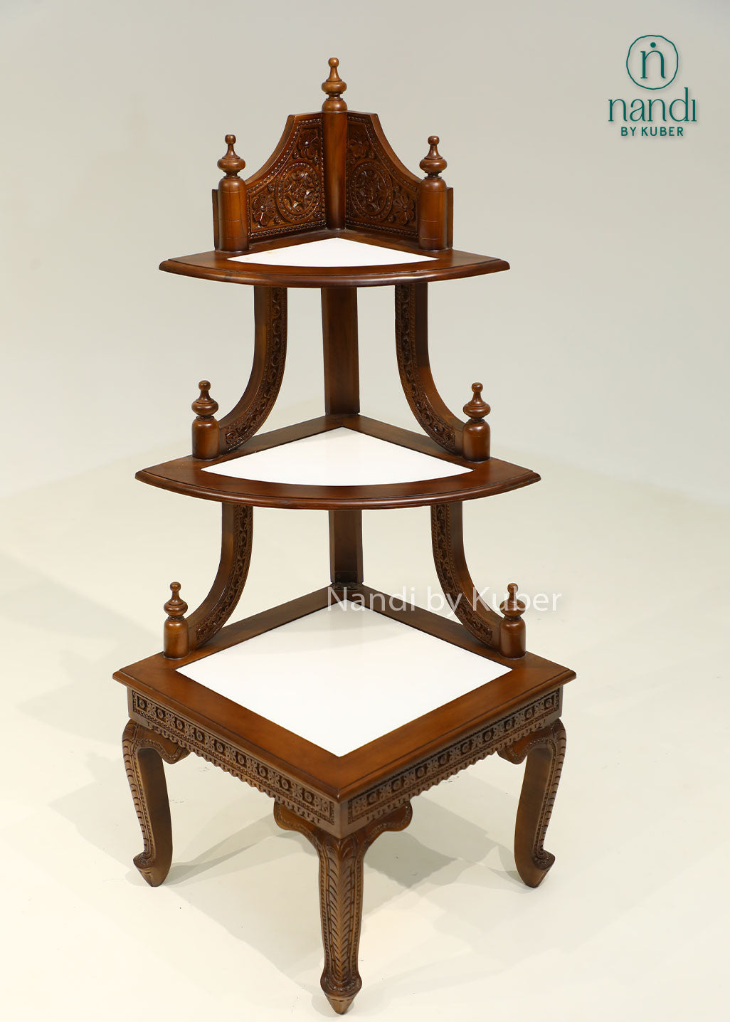 Handcrafted three-tier wooden corner display stand with intricate carvings, perfect for showcasing decorative accents, idols, plants, and collectibles.