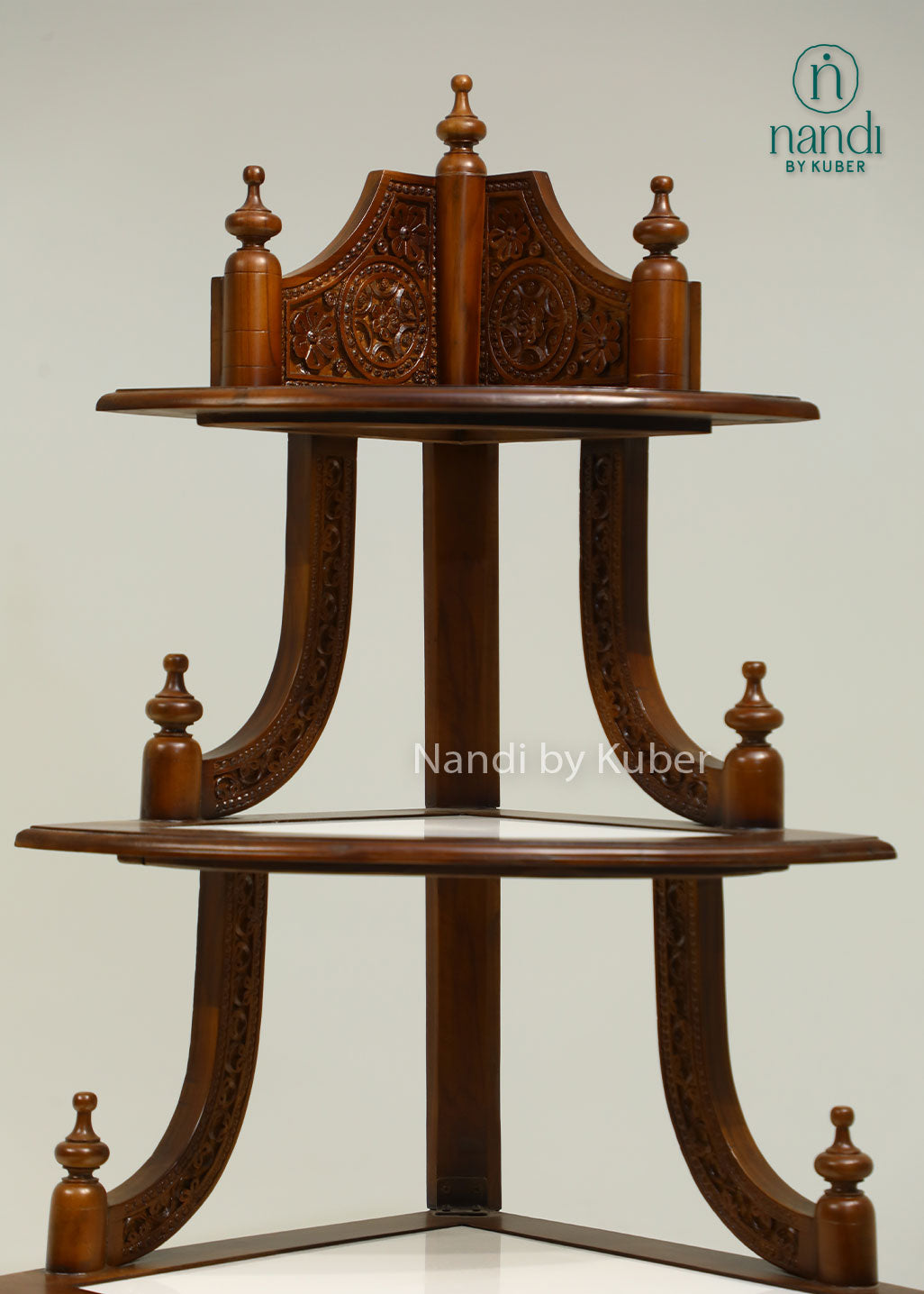 Handcrafted three-tier wooden corner display stand with intricate carvings, perfect for showcasing decorative accents, idols, plants, and collectibles.