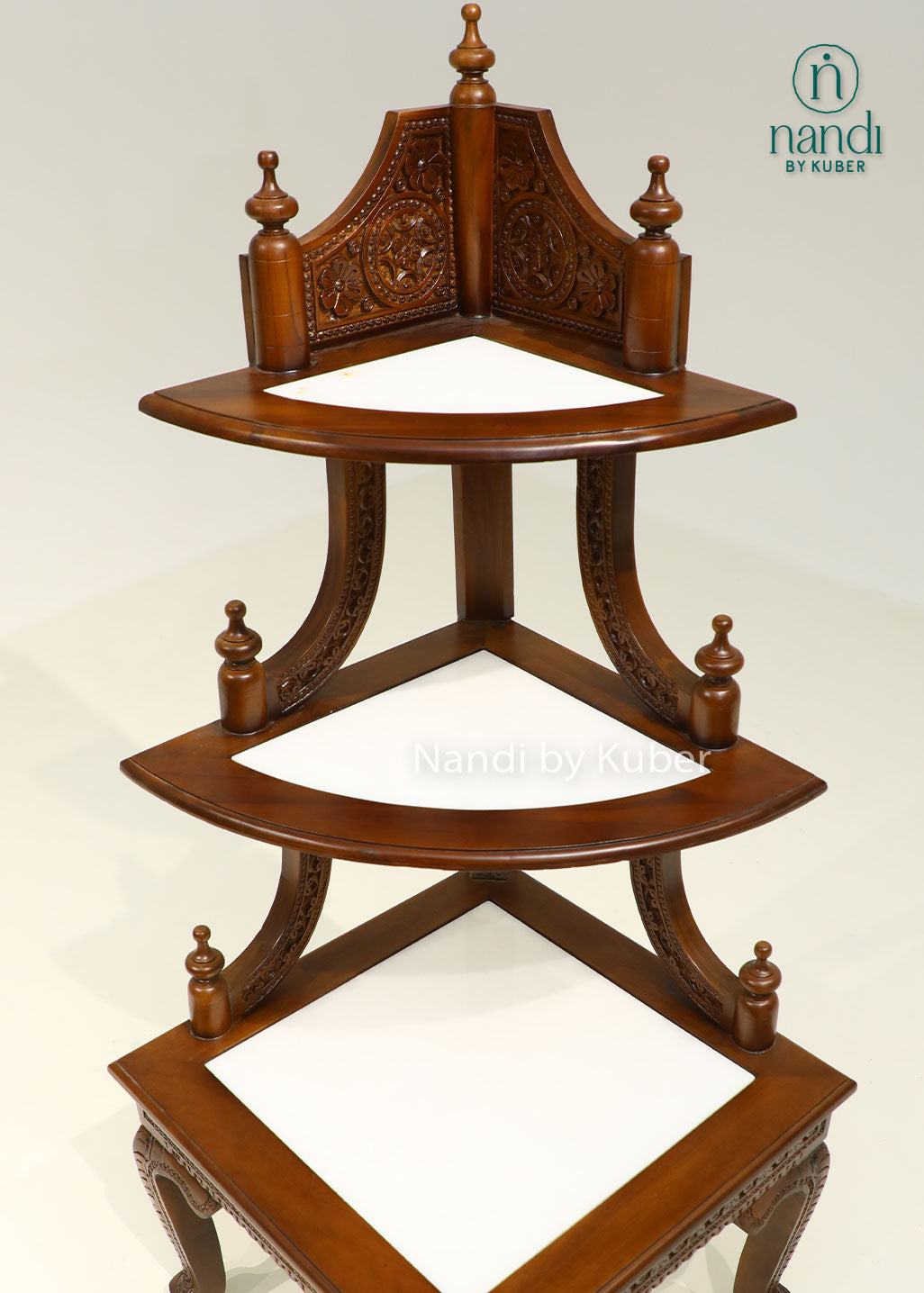 Handcrafted three-tier wooden corner display stand with intricate carvings, perfect for showcasing decorative accents, idols, plants, and collectibles.