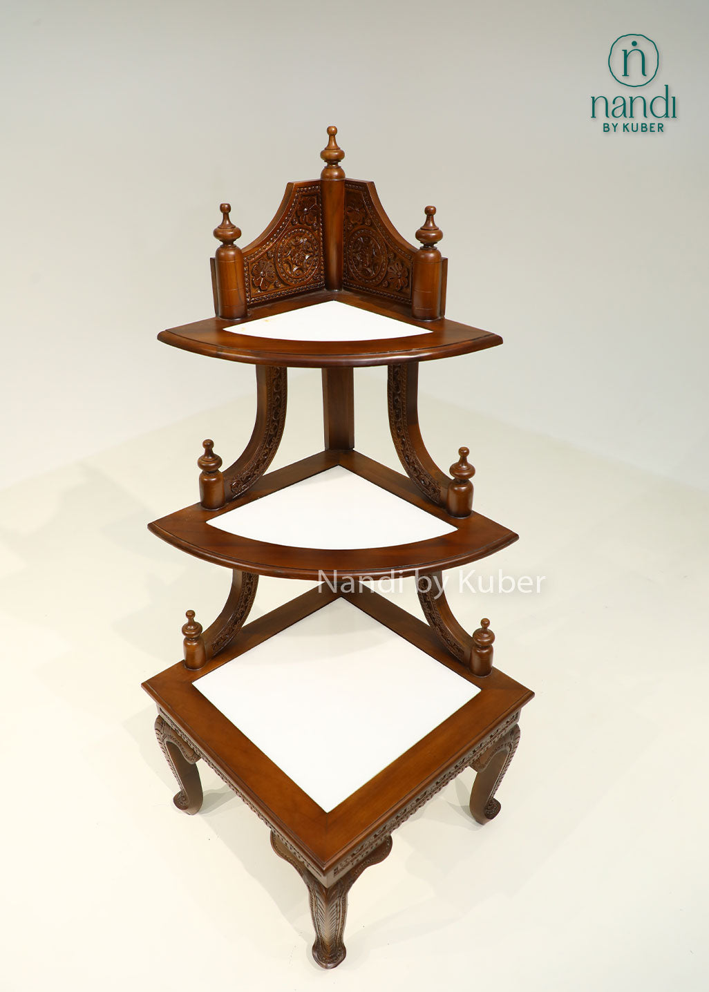 Handcrafted three-tier wooden corner display stand with intricate carvings, perfect for showcasing decorative accents, idols, plants, and collectibles.