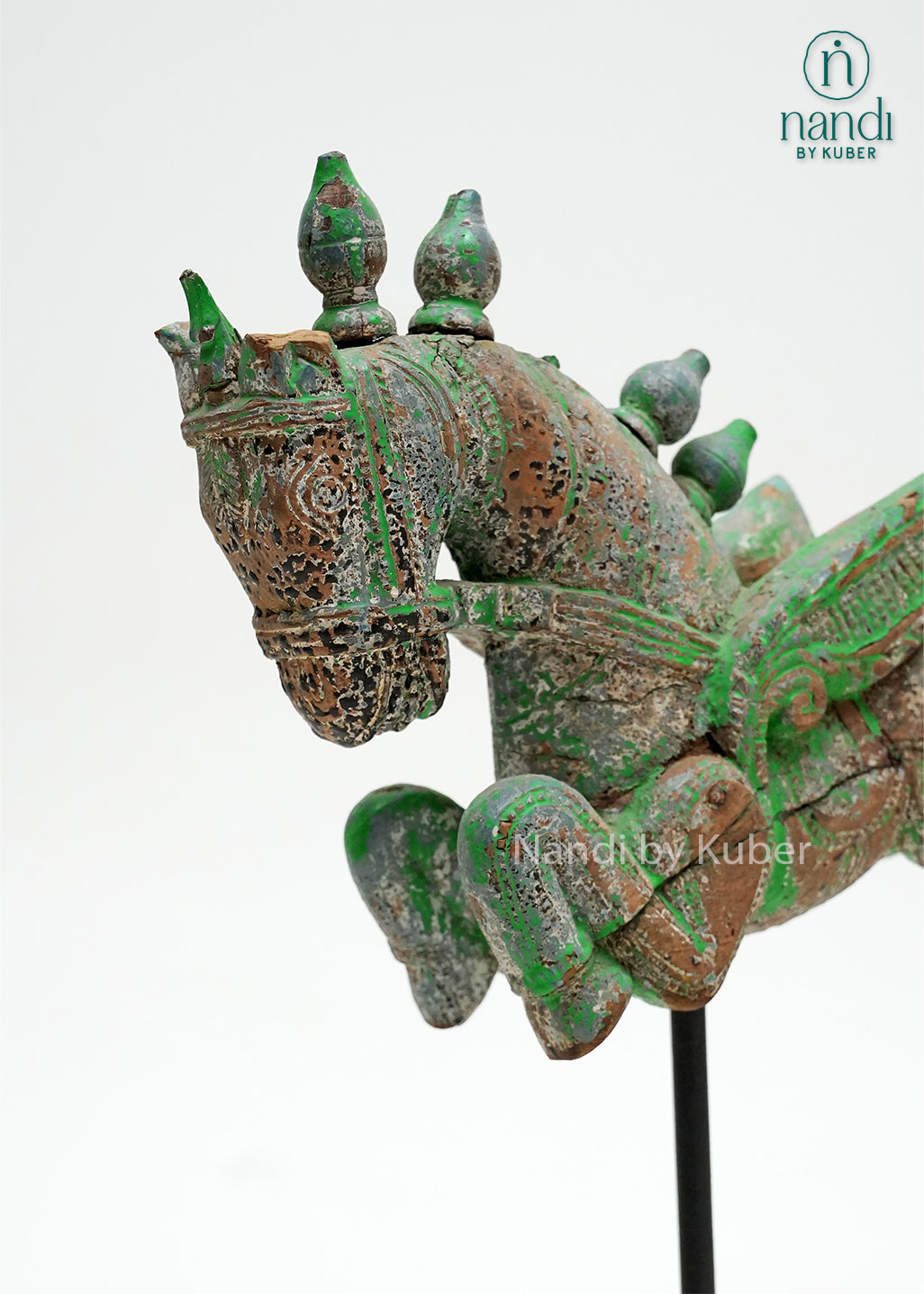 Decorative wooden horse figurine with vintage green finish, mounted on an iron stand and reclaimed wood base, ideal for rustic, bohemian, and heritage-inspired home décor.