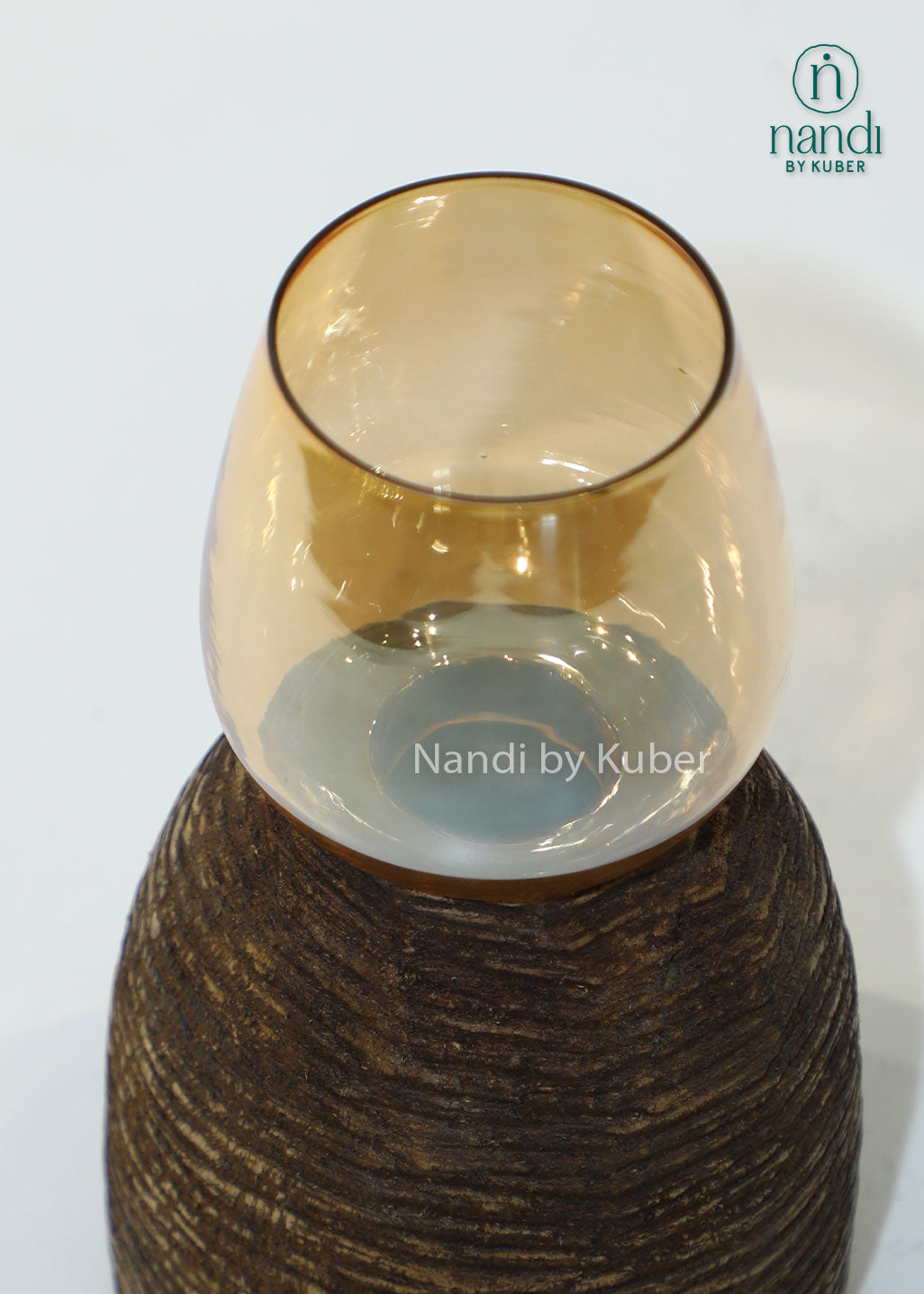 Wooden igloo candle holder with amber glass shade, handcrafted decorative candle stand for home décor, table centerpiece, ambient lighting, festive decoration, rustic styling, and modern interior accents.