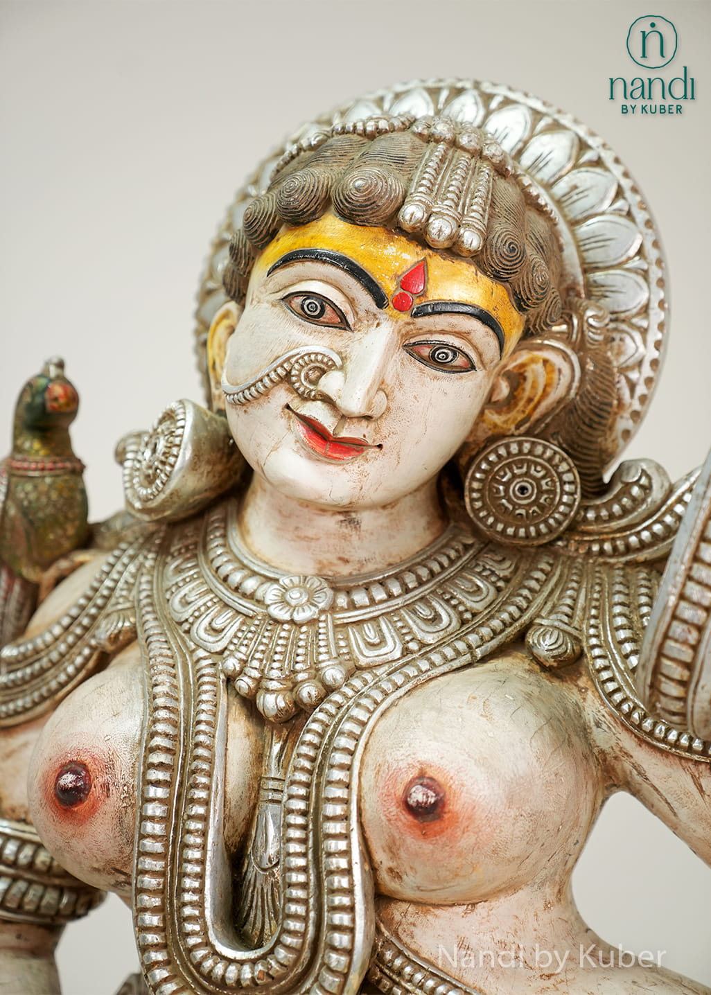 Decorative lady statue with mirror and traditional handcrafted detailing
