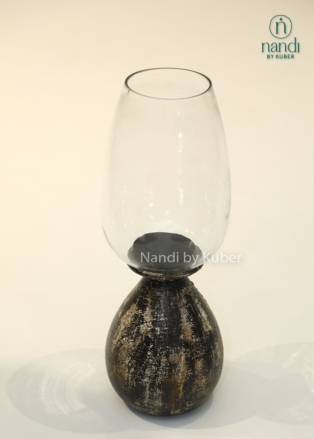 Wooden long matka candle holder with clear glass shade, handcrafted decorative candle stand for home décor, table centerpiece, ambient lighting, festive decoration, and modern rustic interiors.