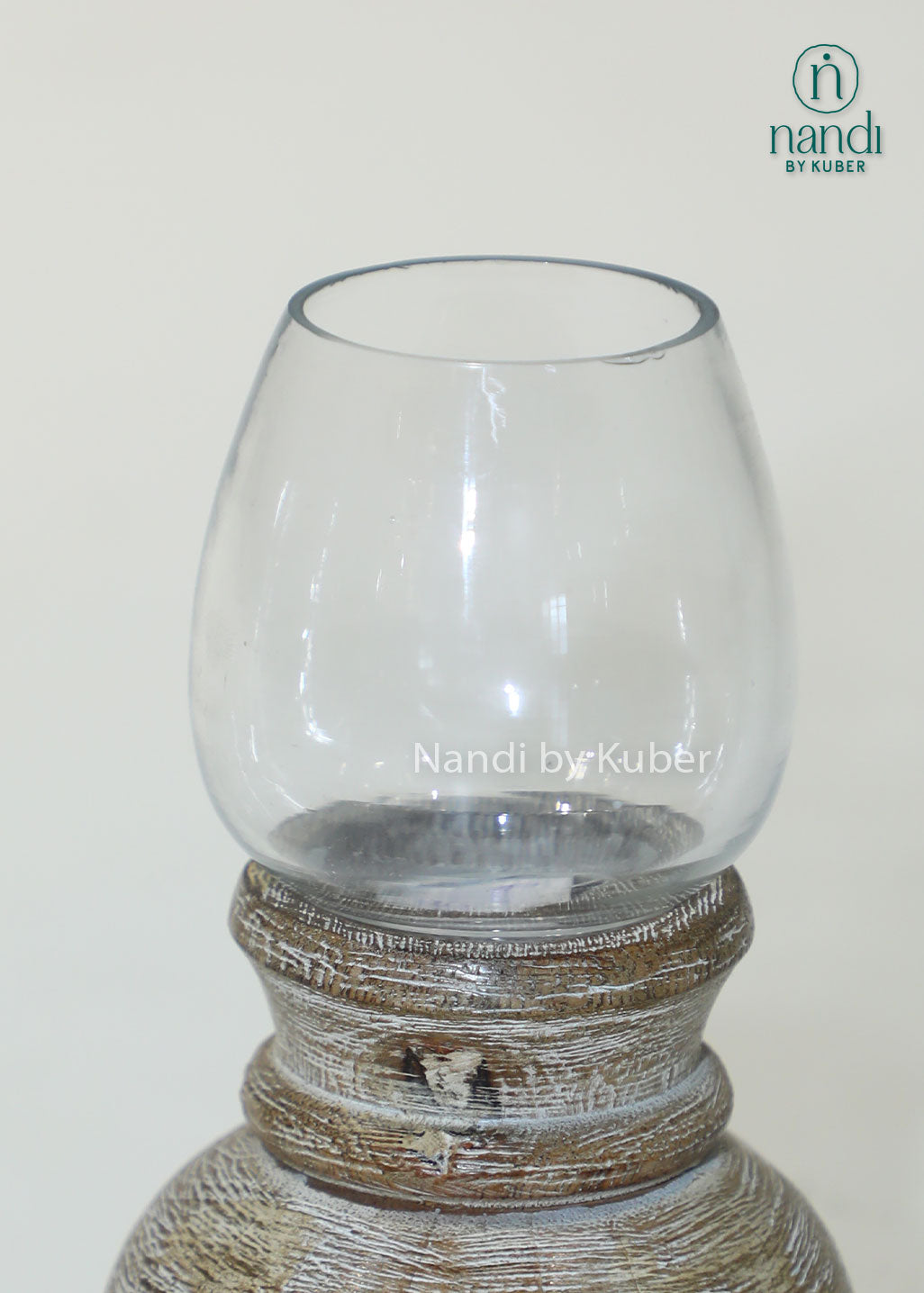 Wooden matki candle holder with clear glass shade, handcrafted decorative candle stand for home décor, table centerpiece, ambient lighting, festive decoration, rustic styling, and elegant living spaces.