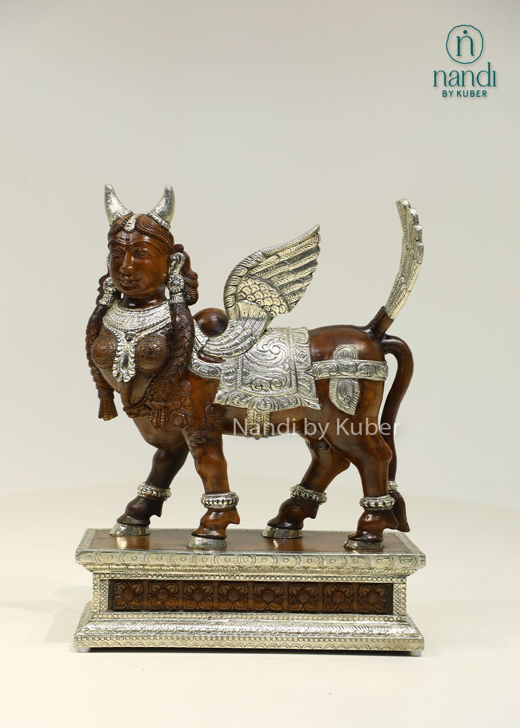 Handcrafted Kamdhenu sculpture with detailed metalwork and wooden accents, symbolizing prosperity, abundance, and spiritual blessings for any décor setting.