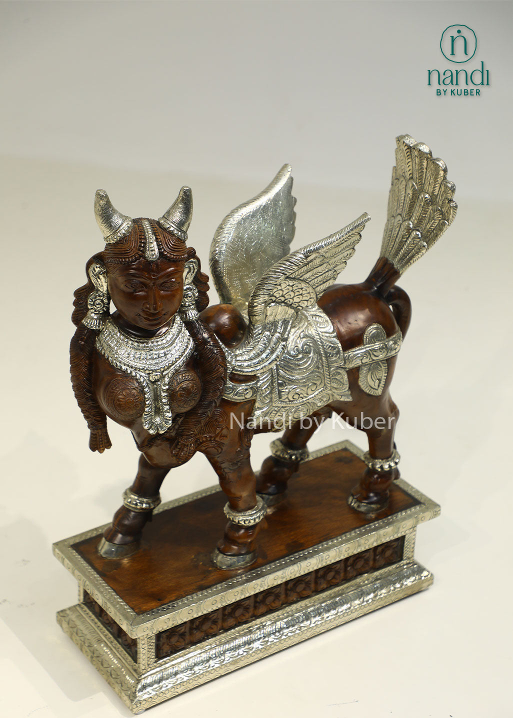 Handcrafted Kamdhenu sculpture with detailed metalwork and wooden accents, symbolizing prosperity, abundance, and spiritual blessings for any décor setting.