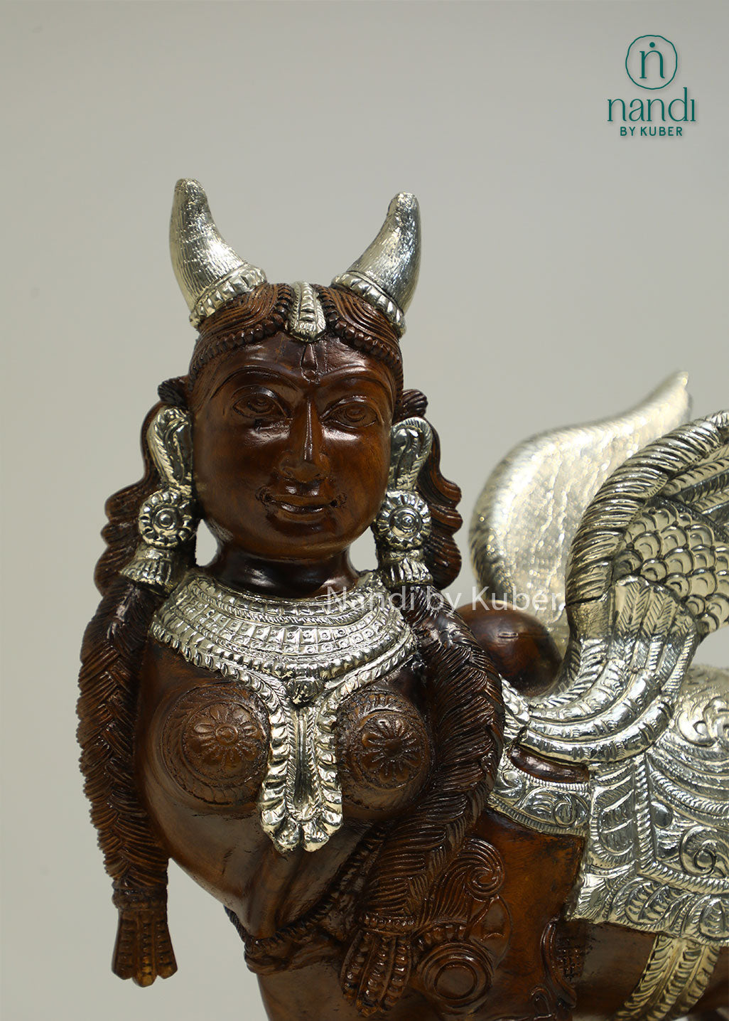 Handcrafted Kamdhenu sculpture with detailed metalwork and wooden accents, symbolizing prosperity, abundance, and spiritual blessings for any décor setting.