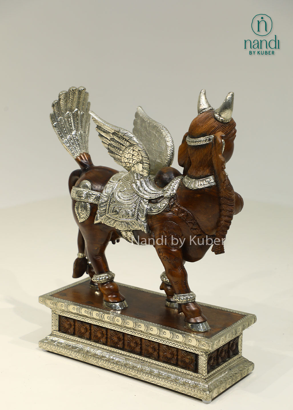 Handcrafted Kamdhenu sculpture with detailed metalwork and wooden accents, symbolizing prosperity, abundance, and spiritual blessings for any décor setting.