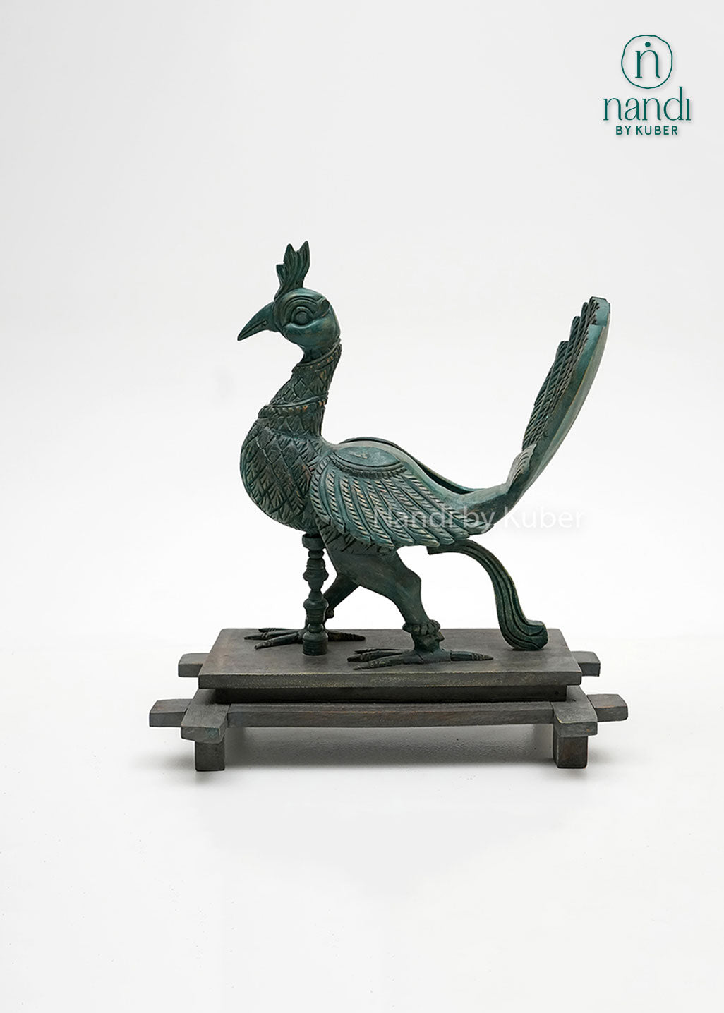 Handcrafted peacock figurine with intricate carved detailing, vintage patina finish, and wooden display base, ideal for luxury home décor, tabletop styling, and artistic collections.