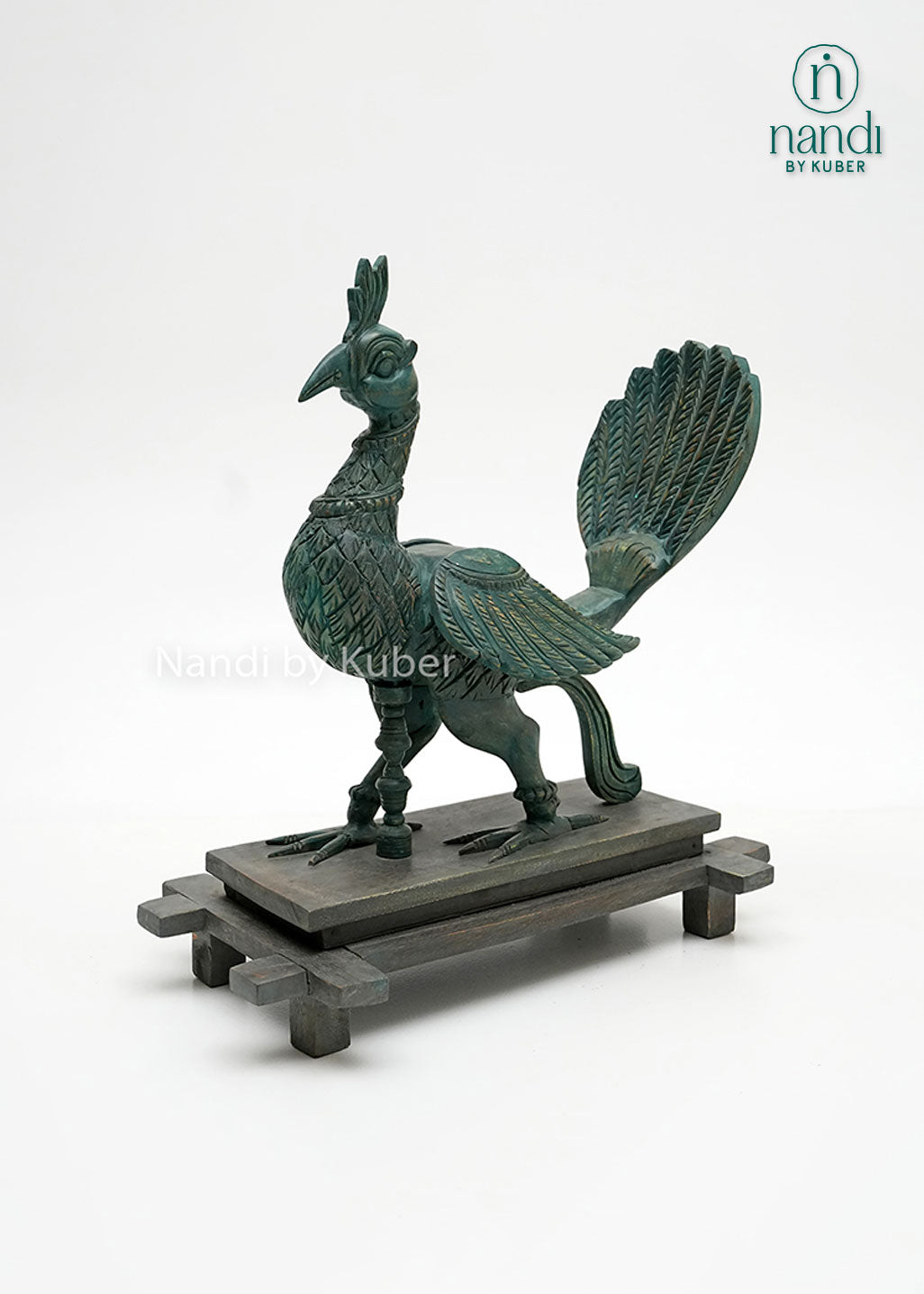 Handcrafted peacock figurine with intricate carved detailing, vintage patina finish, and wooden display base, ideal for luxury home décor, tabletop styling, and artistic collections.