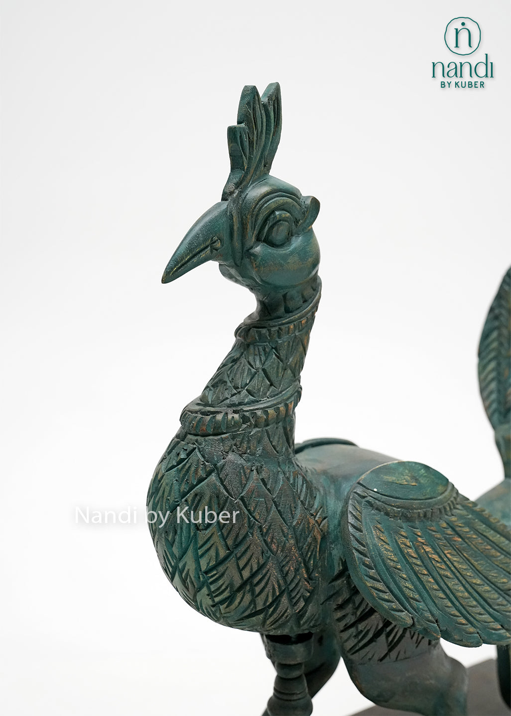 Handcrafted peacock figurine with intricate carved detailing, vintage patina finish, and wooden display base, ideal for luxury home décor, tabletop styling, and artistic collections.