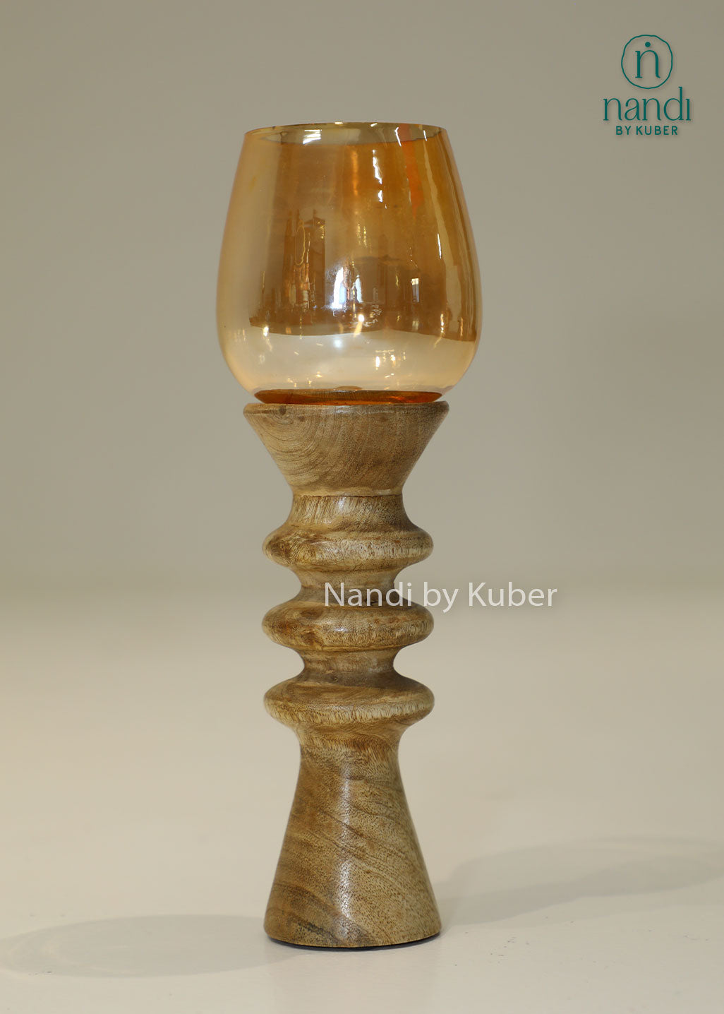 Decorative wooden candle stand with a spiral-turned base and amber glass shade, adding warmth and elegance to any interior setting.