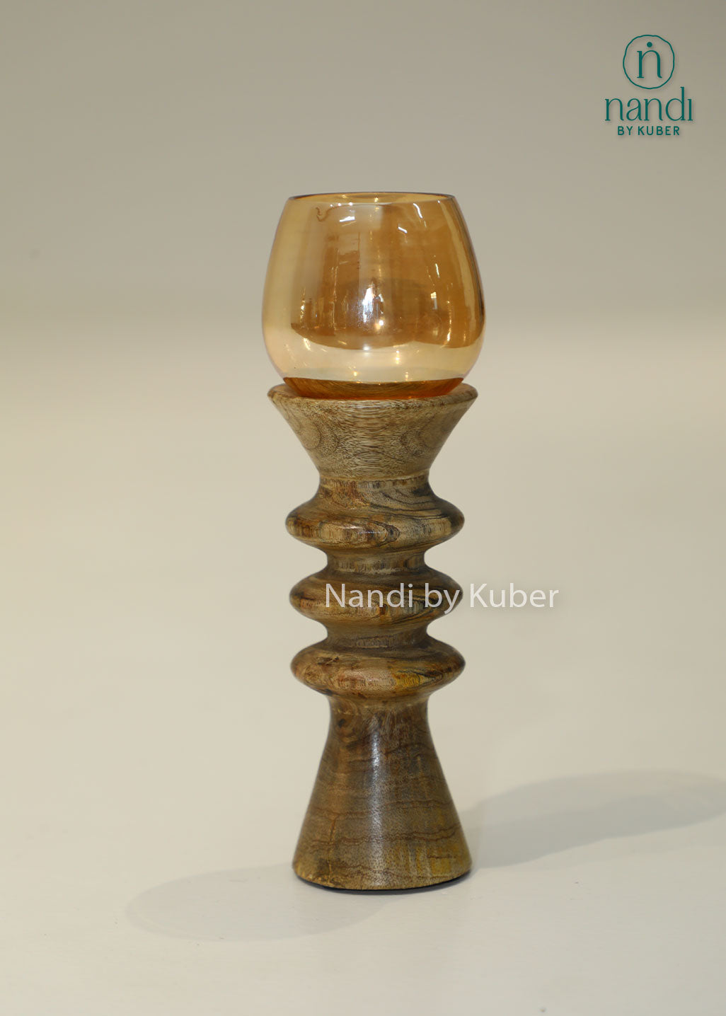 Decorative wooden candle stand with a spiral-turned base and amber glass shade, adding warmth and elegance to any interior setting.