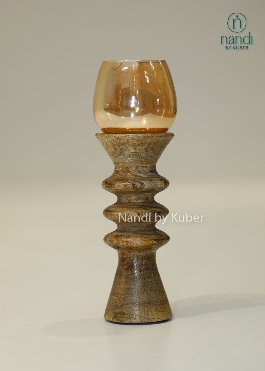 Decorative wooden candle stand with a spiral-turned base and amber glass shade, adding warmth and elegance to any interior setting.