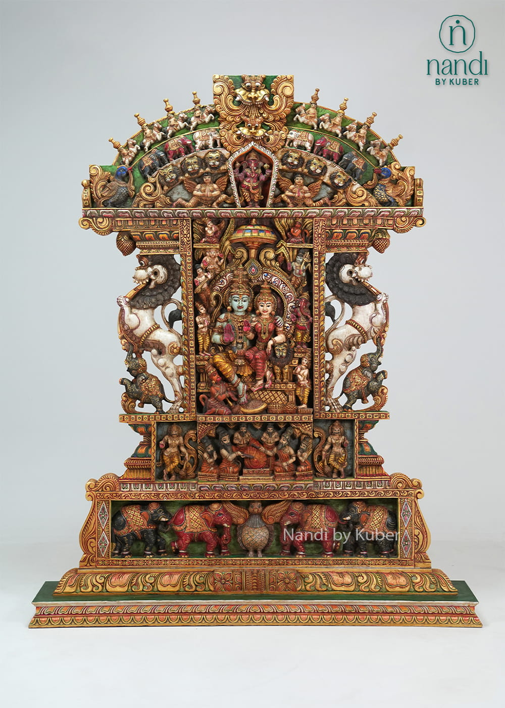Handcrafted wooden Ram Darbar shrine with ornate temple arch, detailed carvings, vibrant colors, and traditional devotional artwork.